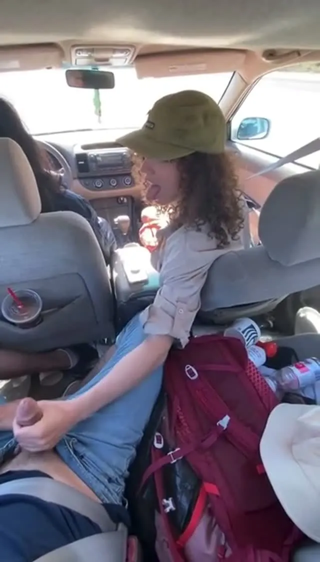 curly chick jerking dude in the backseat while her friend drives